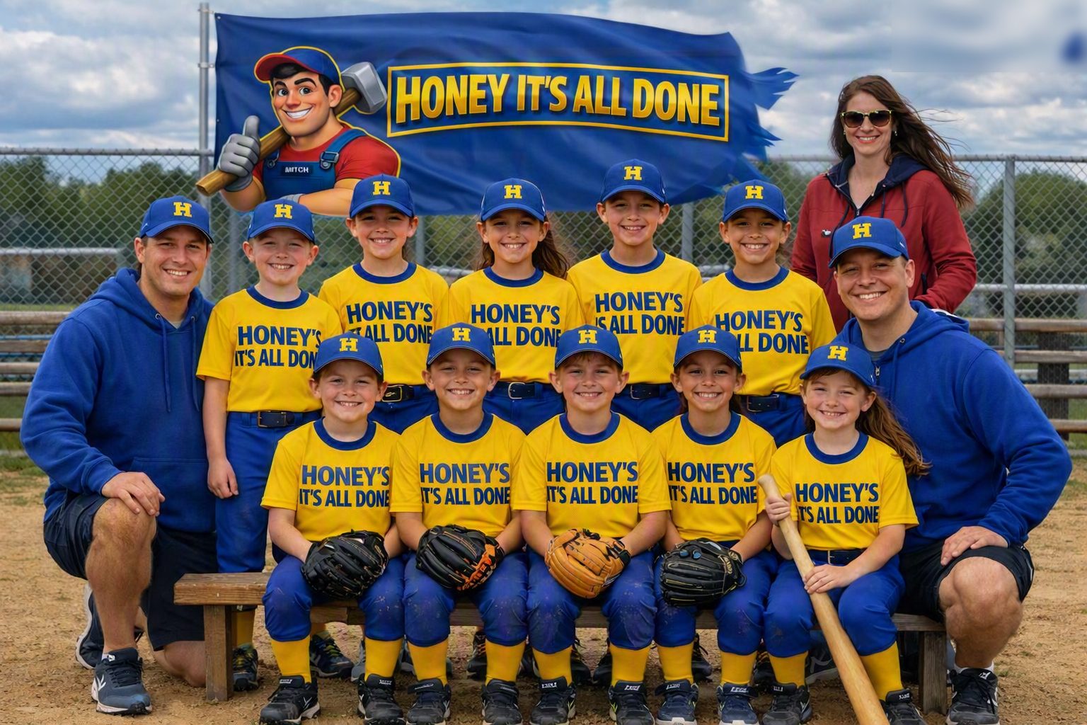 Youth ball team in Honey It's All Done jerseys and caps with their coaches in front of a Honey It's All Done sponsor banner
